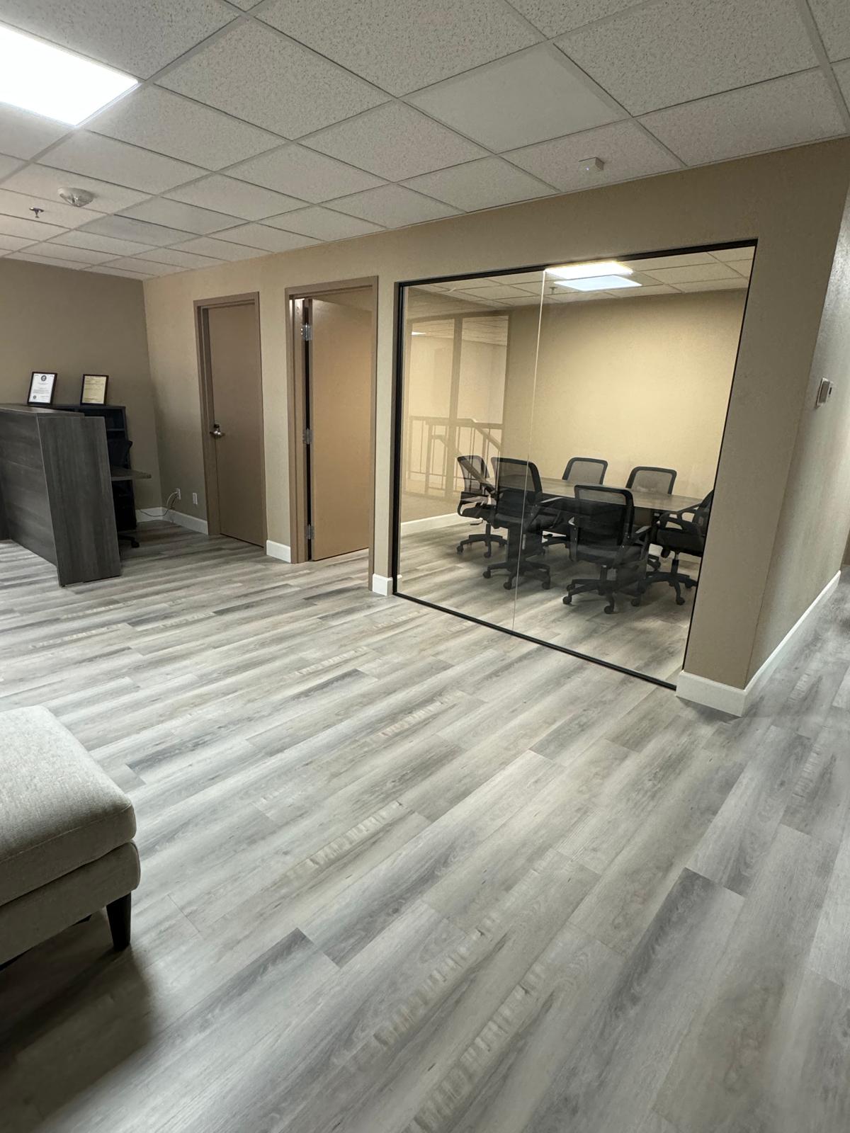Inside The Office Business Center, with reception and the conference room